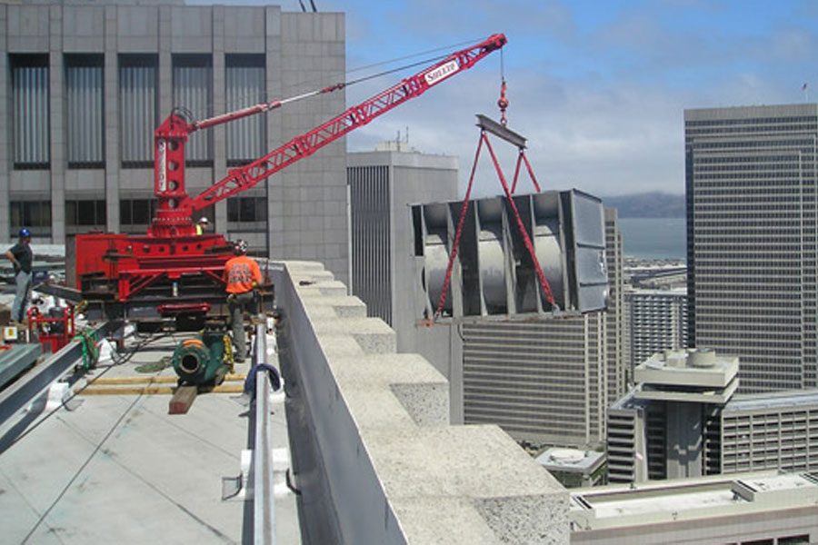 Crane holding item on roof - Bay area crane rental service concept image